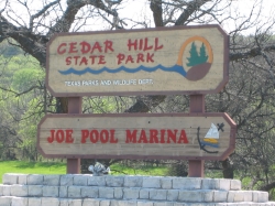 the entrance sign for Cedar Hill State Park